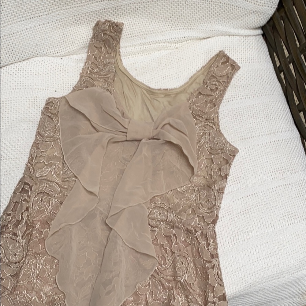 Lace tank beige with cute bow on back.